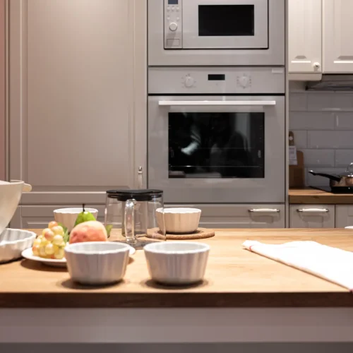 part-kitchen-interior-with-utensils-fruits-table-modern-kitchen